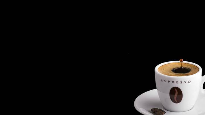 Espresso Coffee In White Cup With Beans
