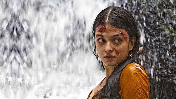 Aish Wallpaper Near Waterfall In Orange Suit