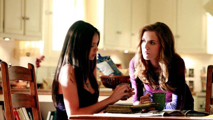Elena Sitting on Kitchen Table With her Mom