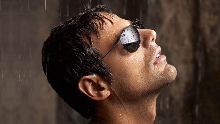 Male Model Wearing Black Goggles in Rain