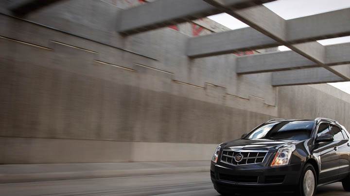 Cadillac 2011 SRX Running on Street