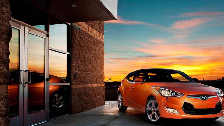 Orange Hyundai Veloster Outside House