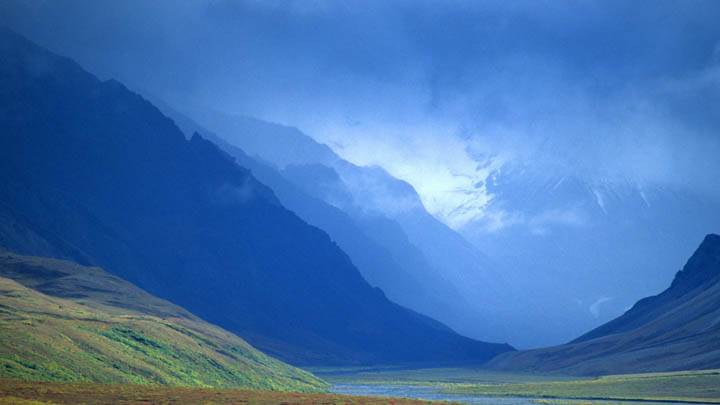 Passing Storm Clouds Lift to Reveal a Colorful Arctic Valley