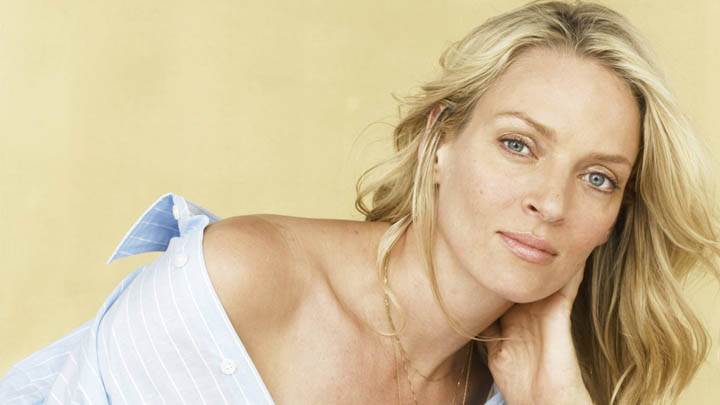 Uma Thurman Smilig In Blue Shirt