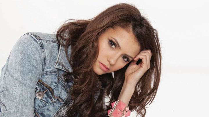 Nina Dobrev Sitting in Blue Jacket Pink Lips