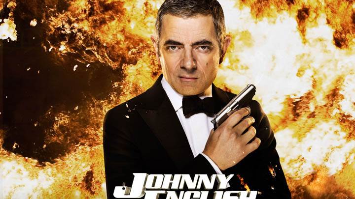 Johnny English Reborn – Rowan Atkinson Holding A Gun In Hand