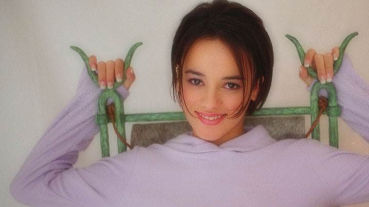 Alizee Jacotey Sitting On A Chair In Pink Top