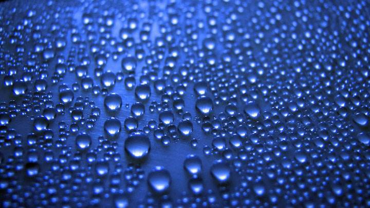 Water Drops On Blue Background