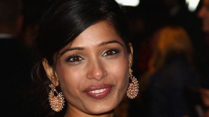 Freida Pinto Golden Earing And Smiling