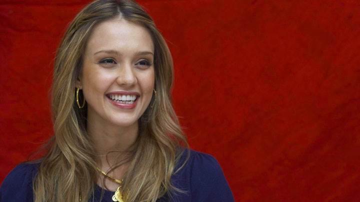 Jessica Alba Laughing In Blue Dress And Red Background