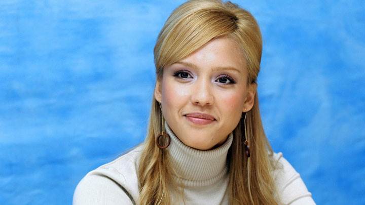 Jessica Alba Smiling Sitting Pose And Blue Background