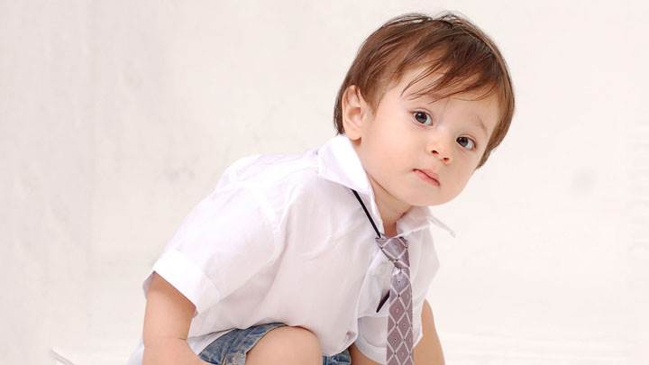 Little Kid Sitting In School Dress