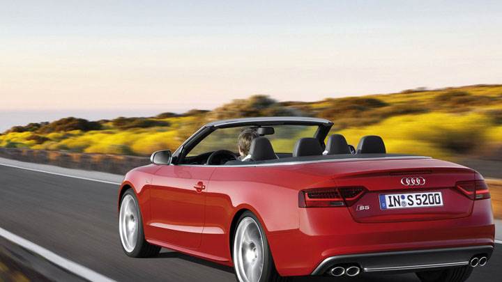 Red 2012 Audi S5 Cabriolet on Highway